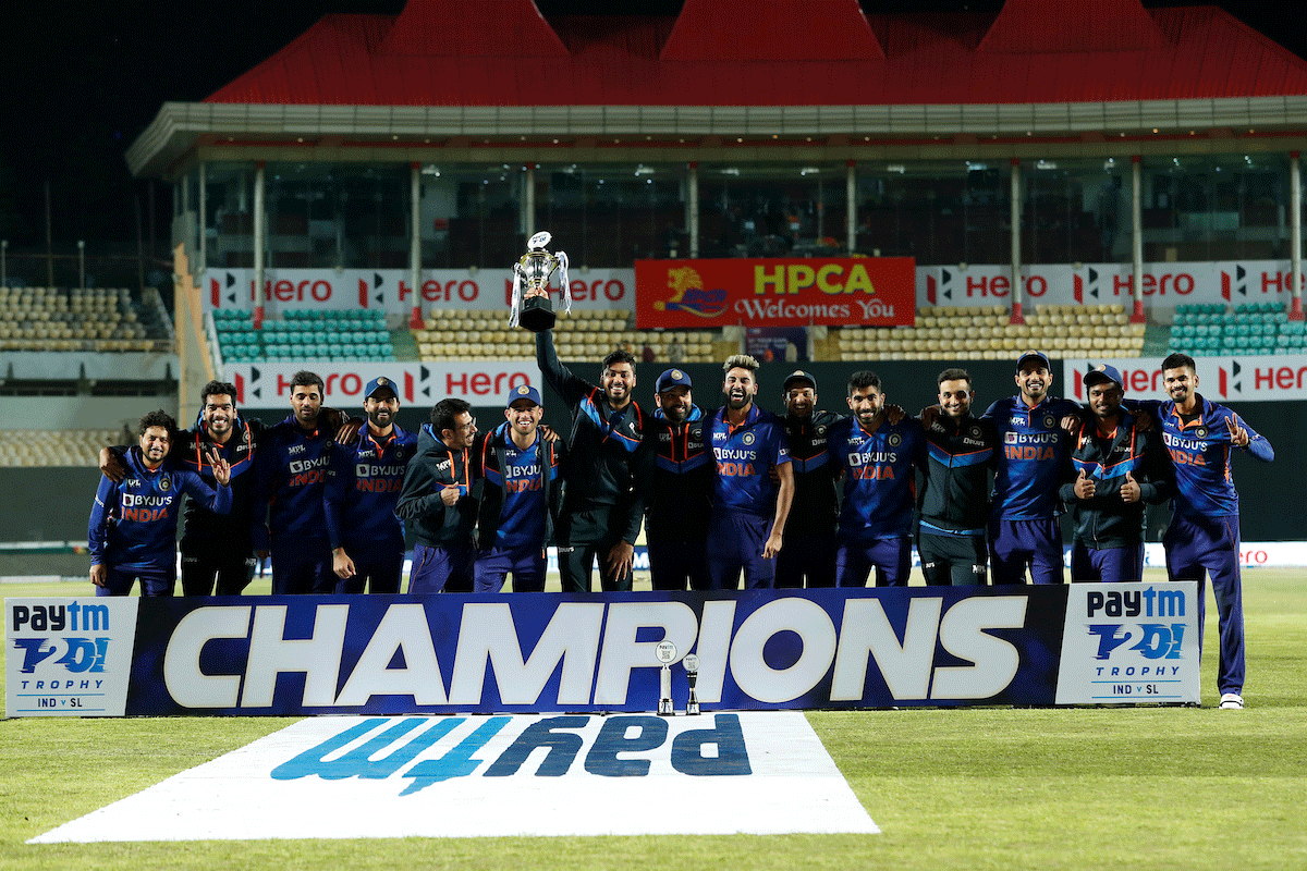 India players celebrate with the trophy on winning the series on Sunday. 