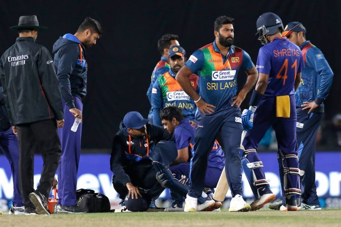 : Team India medicos attend to opener Ishan Kishan after he was hit on the head by a bouncer from Lahiru Kumara during the second T20 International, in Dharamsala, on Saturday. 
