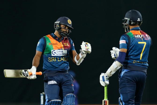 Chamika Karunaratne and Dasun Shanaka celebrate a boundary. 