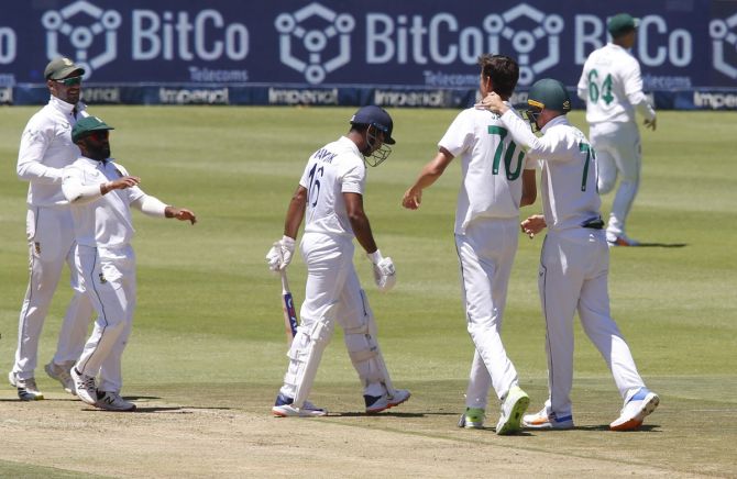 South Africa's players rejoice as India opener Mayank Agarwal walks back after being dismissed by Marco Jansen