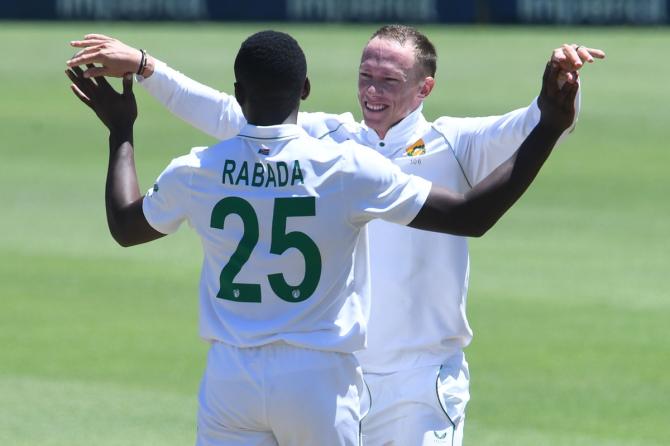 Kagiso Rabada and Rassie van der Dussen celebrate after teaming to dismiss Hanuma Vihari.