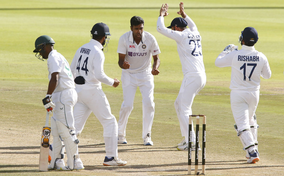 Ravichandran Ashwin celebrates with teammates after taking the wicket of South Africa's Keegan Petersen.