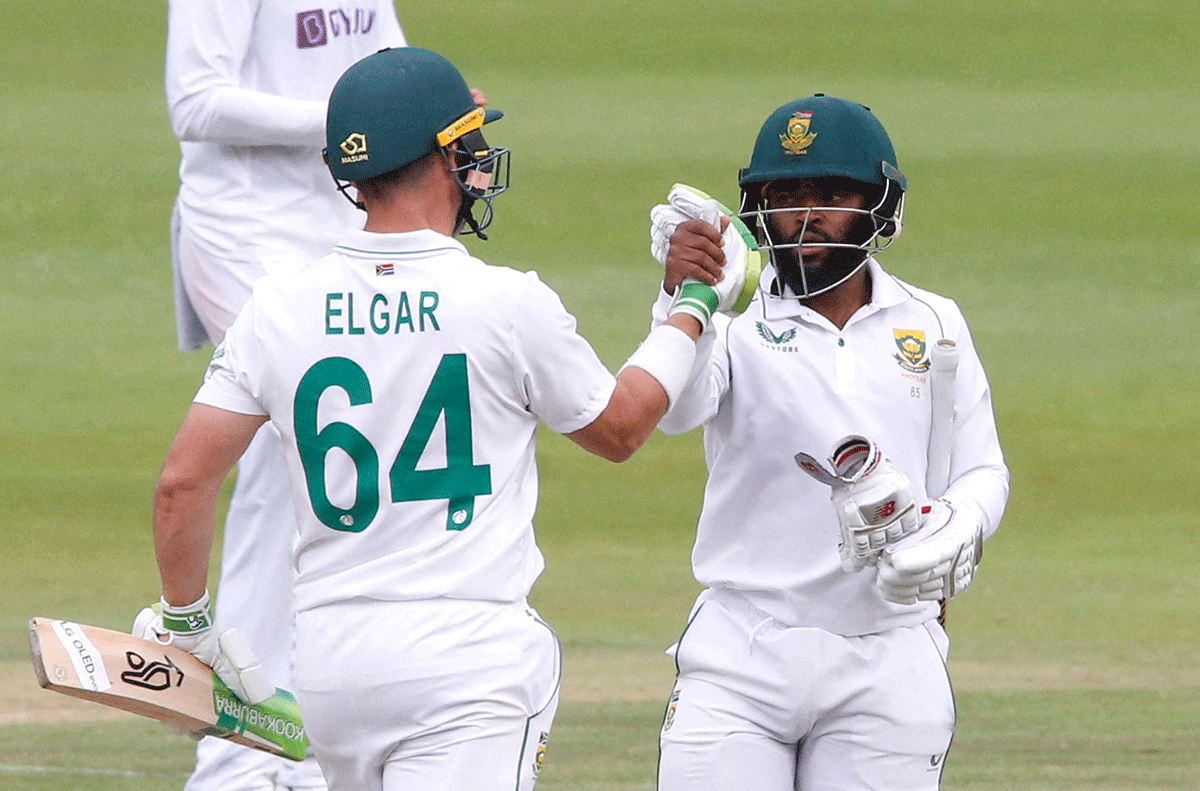 South Africa's Dean Elgar and Temba Bavuma celebrate winning the second Test against India 