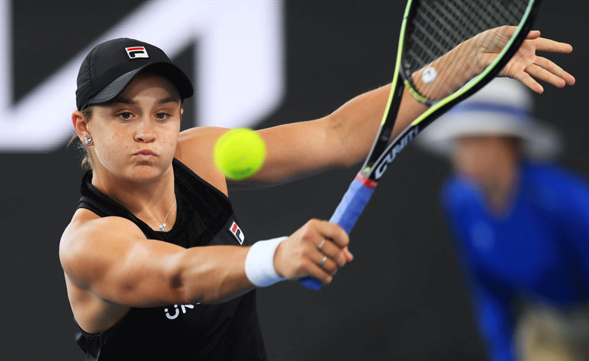 Ashleigh Barty hits a backhand return against Iga Swiatek during day seven of the 2022 Adelaide International at Memorial Drive in Adelaide on Saturday