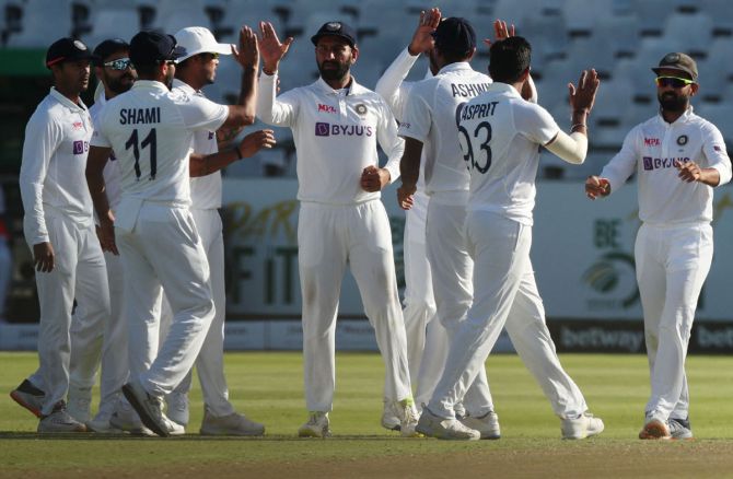 India players celebrate the wicket of South Africa's Dean Elgar