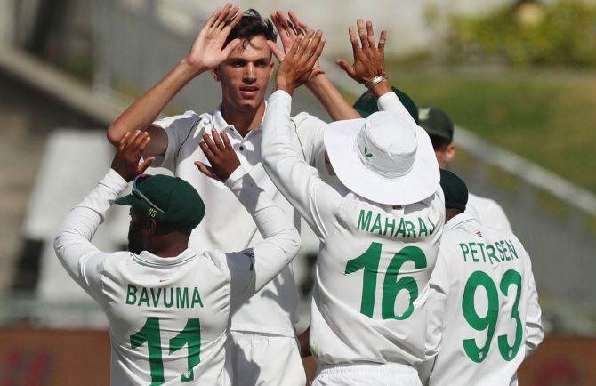 South Africa's Marco Jansen celebrates after taking the wicket of Ravichandran Ashwin