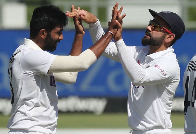 India pacer Jasprit Bumrah celebrates with skipper Virat Kohli after dismissing South Africa's Keegan Petersen during Day 2 of the third Test against South Africa at Newlands, Cape Town, on Wednesday.
