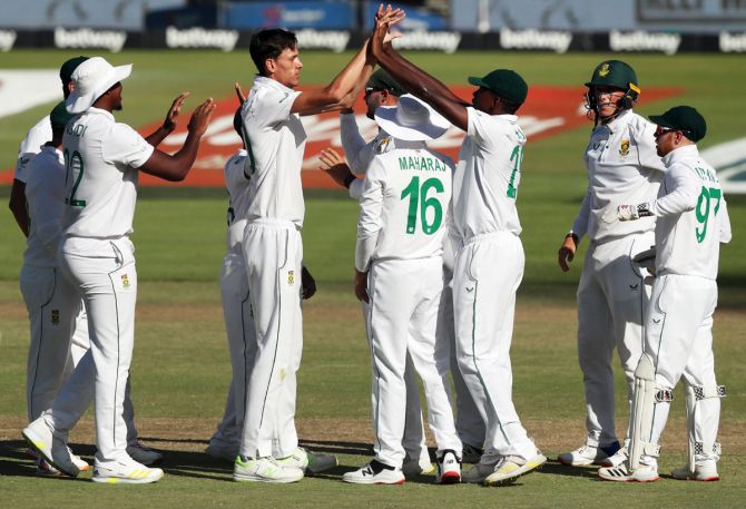 South Africa pacer Marco Jansen celebrates with teammates after taking the wicket of India opener K L Rahul. 
