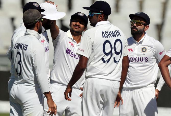 India players celebrate after South Africa's Aiden Markram is dismissed.