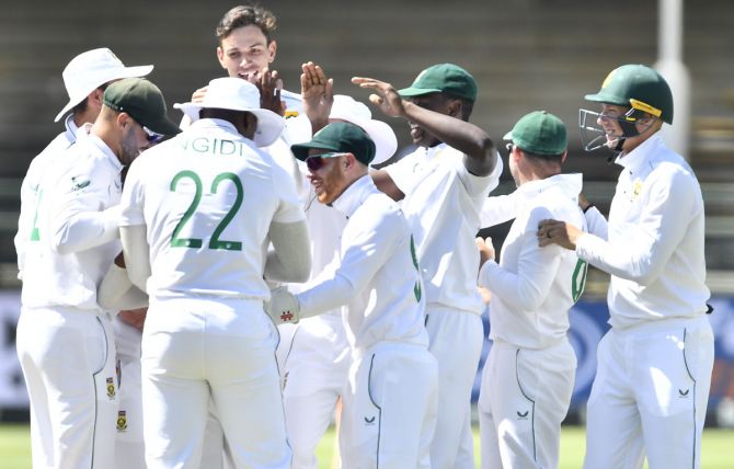 South Africa's players celebrate after Marco Jansen dismisses Cheteshwar Pujara.