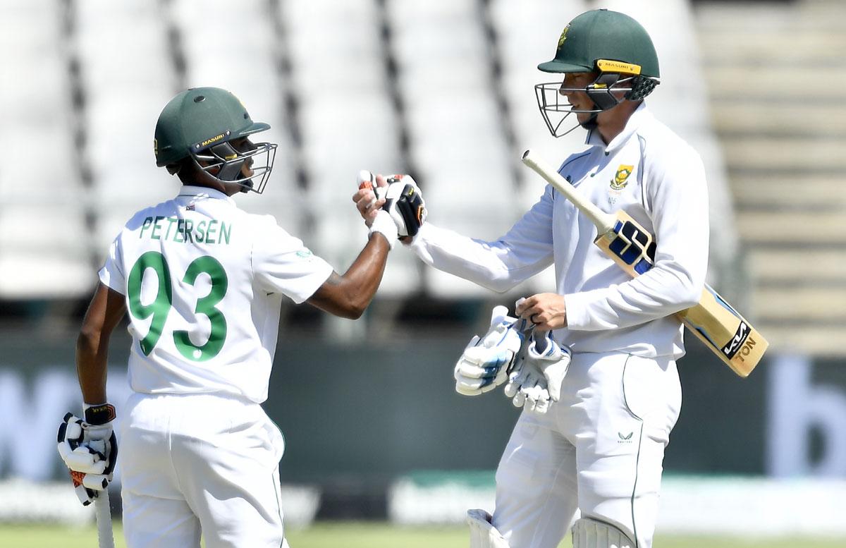 Keegan Peterson celebrates with Rassie van der Dussen after completing his 50.