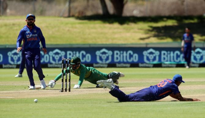 South Africa skipper Temba Bavuma dives to make his crease.