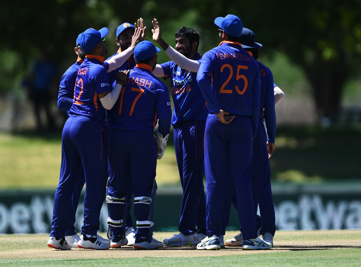 India pacer Jasprit Bumrah celebrates with teammates after dismissing Janneman Malan.