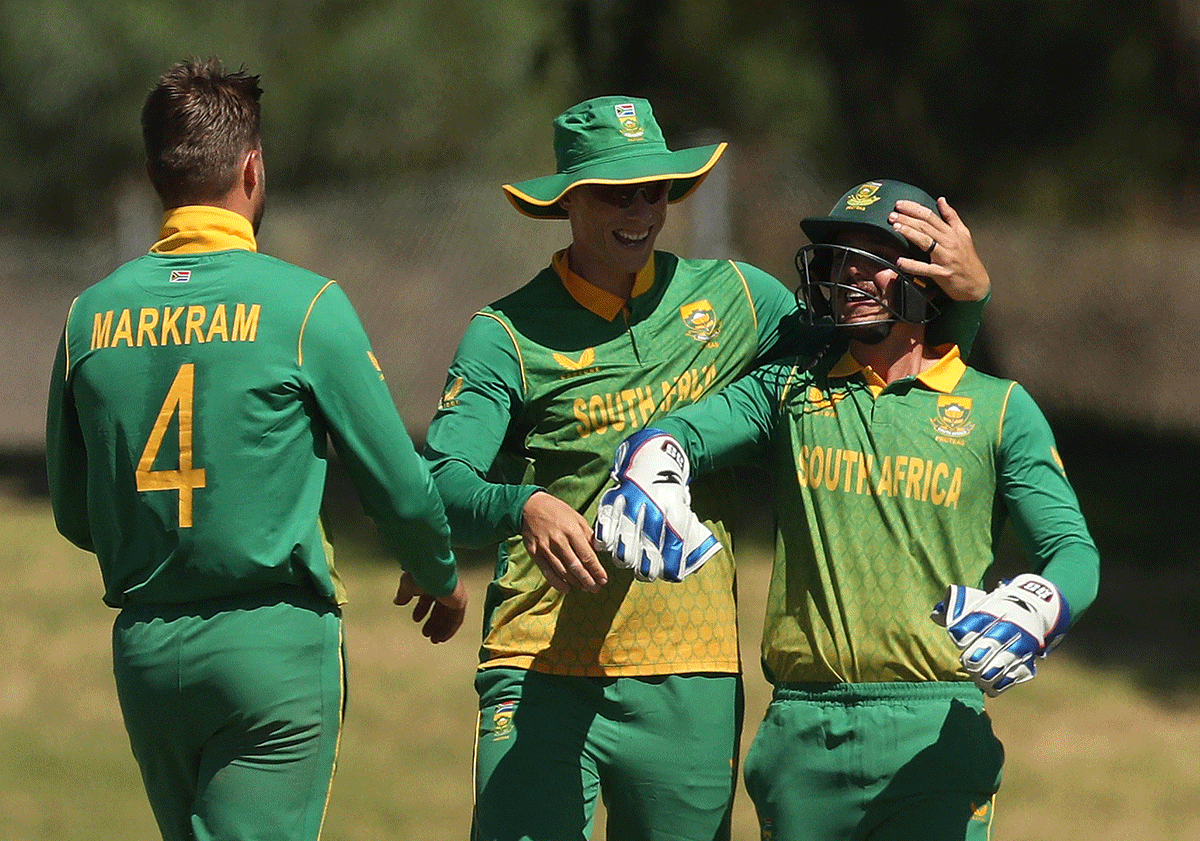 South Africa's Aiden Markram celebrates with teammates after taking the wicket of India's KL Rahul