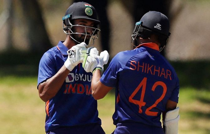 India openers K L Rahul and Shikhar Dhawan bump fists during their 63-run partnership.
