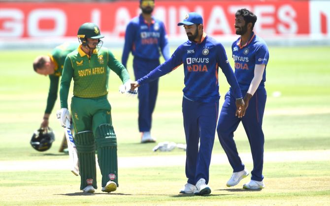 India's captain K L Rahul congratulates South Africa opener Quinton de Kock as he walks off the field after scoring 124 off 130 balls in the third ODI in Cape Town on Sunday.