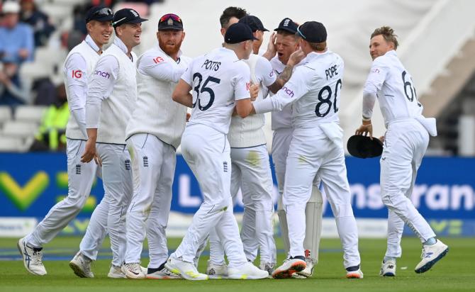 England wicketkeeper Sam Billings is congratulated after taking a catch to see the back of India's Shreyas Iyer.