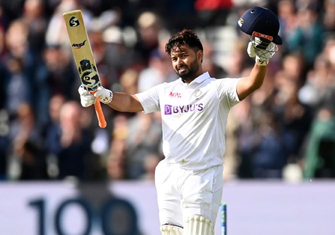 Rishabh Pant acknowledges the applause from the crowd after completing his century.  