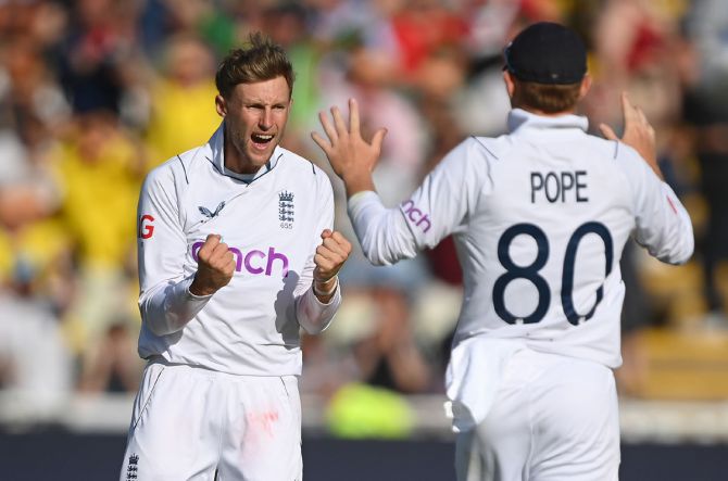 Joe Root of England celebrates taking the wicket of Rishabh Pant.