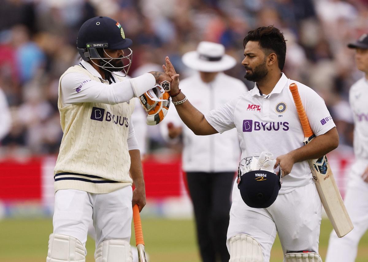 Rishabh Pant and Ravindra Jadeja celebrate as they walk off the ground at tea.