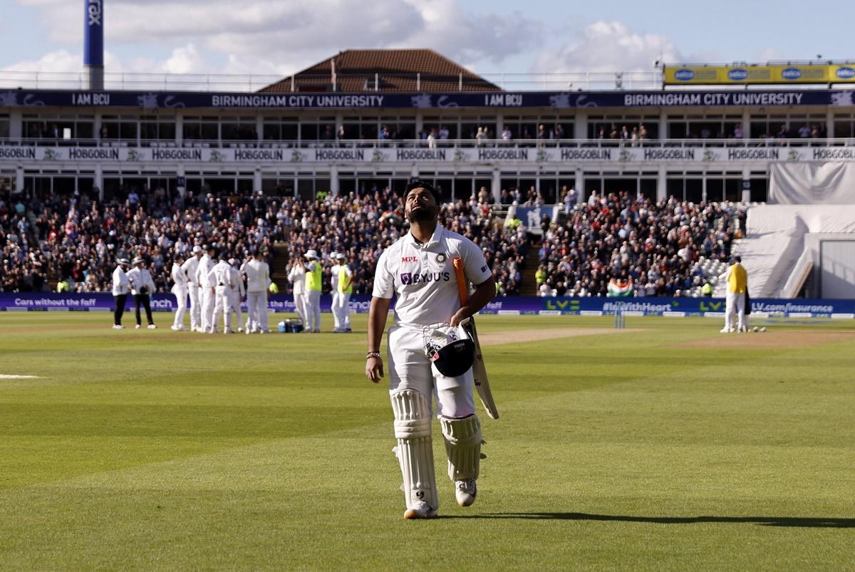 Rishabh Pant walks back after being dismissed for a magnificent 146.