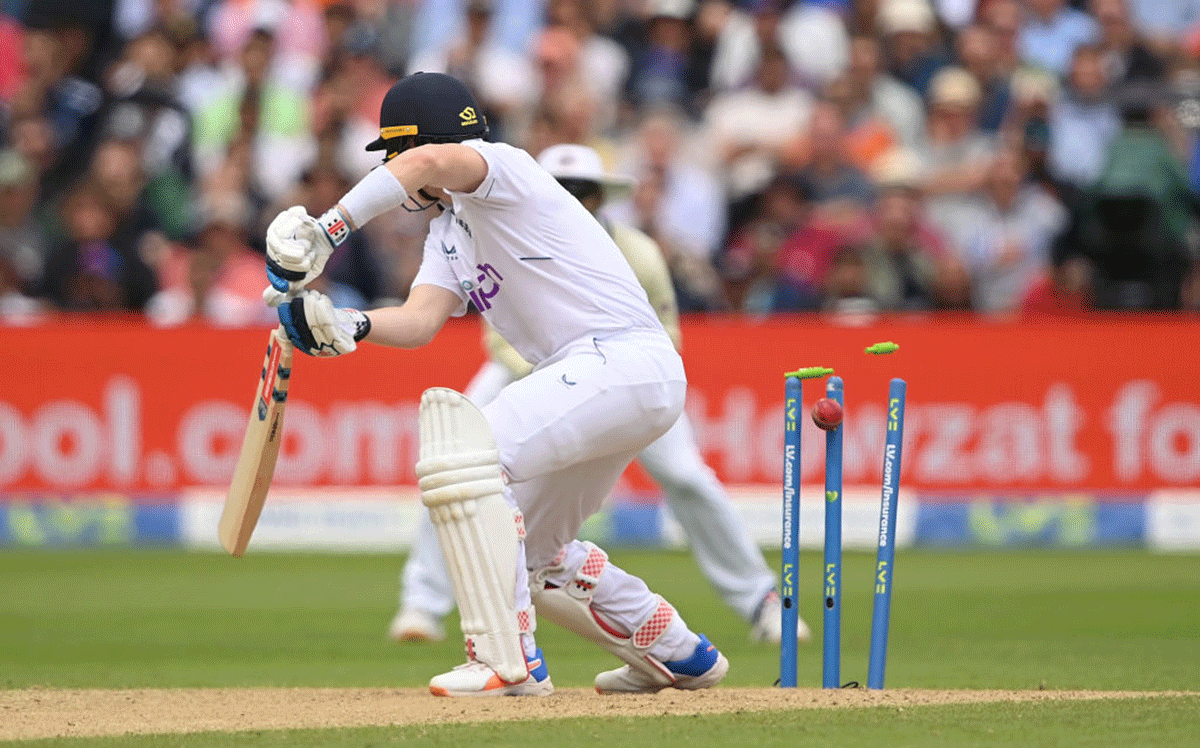 Sam Billings of England is bowled by Mohammed Siraj