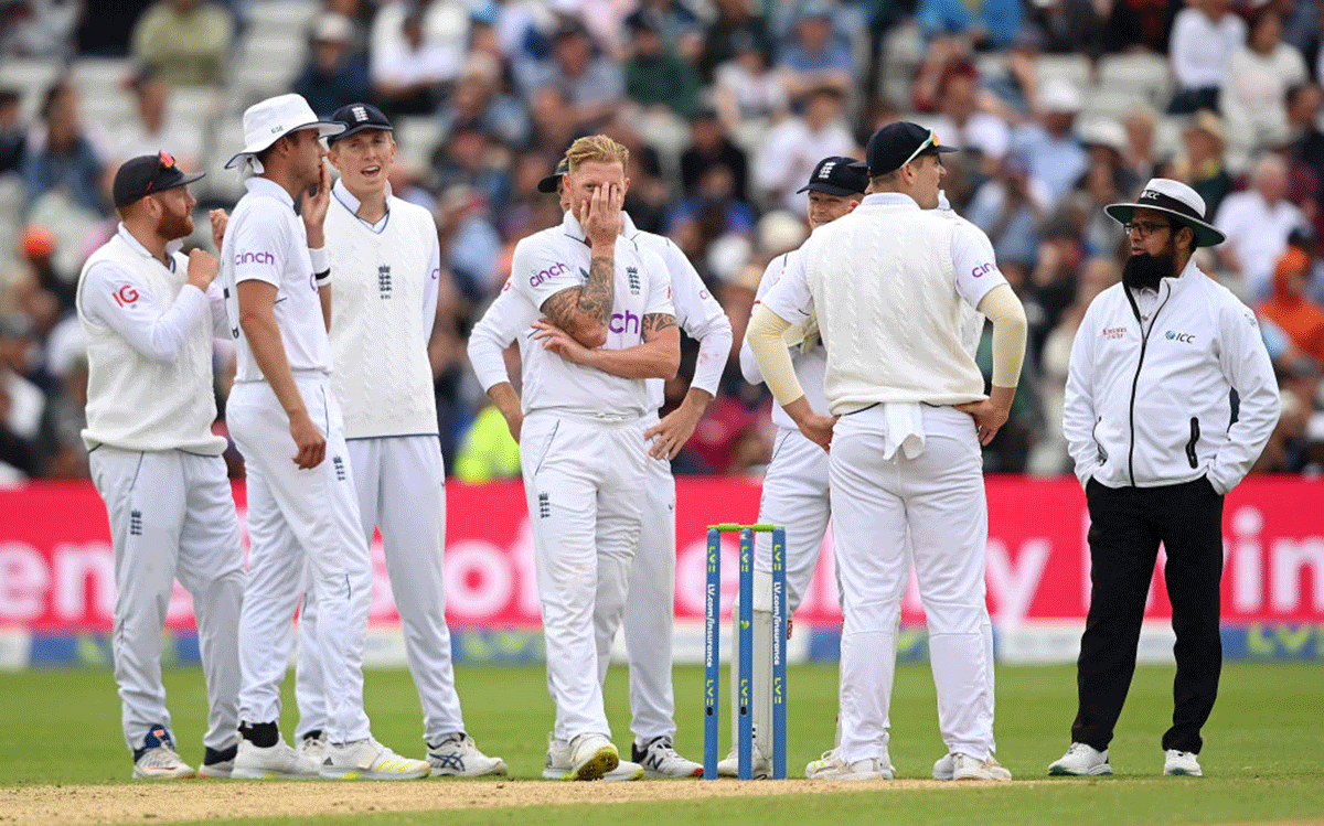 England captain Ben Stokes  reacts with teammates after a unsuccessful review for the wicket of Cheteshwar Pujara