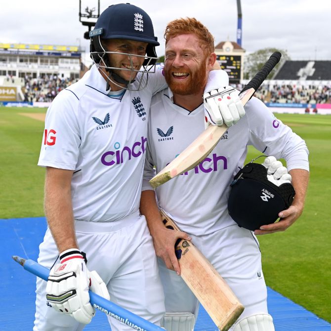 A delighted Joe Root and Jonny Bairstow celebrate winning the fifth Test against India.