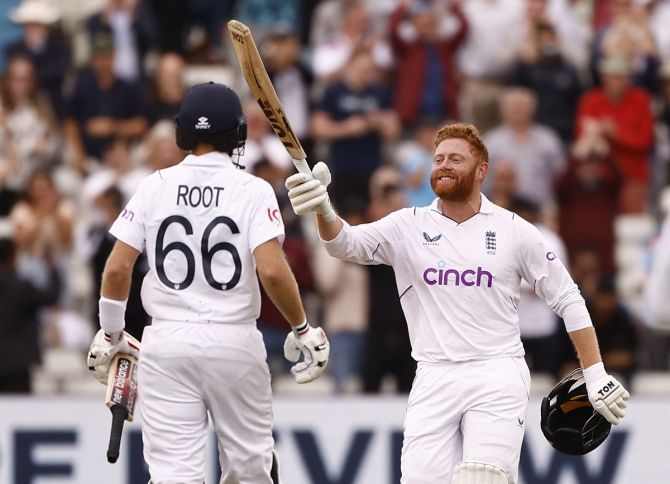 England's Jonny Bairstow celebrates scoring a hundred with Joe Root in the fifth Test against India at Edgbaston, Birmingham, on July 5, 2022.