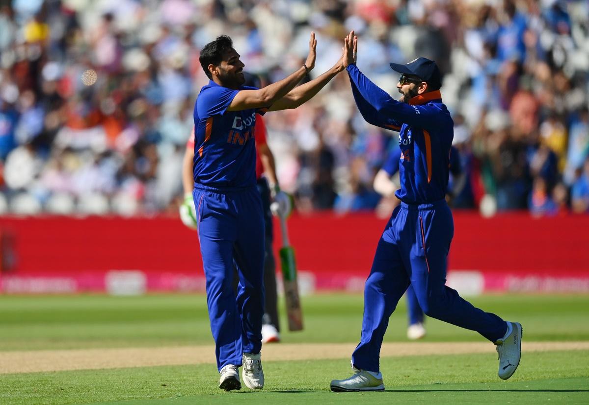 Bhuvneshwar Kumar celebrates with Virat Kohli after dismissing England's Jason Roy during the second T20 at Edgbaston, in Birmingham, on Saturday.