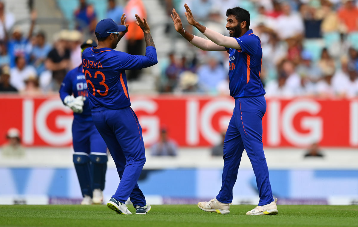 Jasprit Bumrah celebrates with team-mate Suryakumar Yadav after dismissing Liam Livingstone