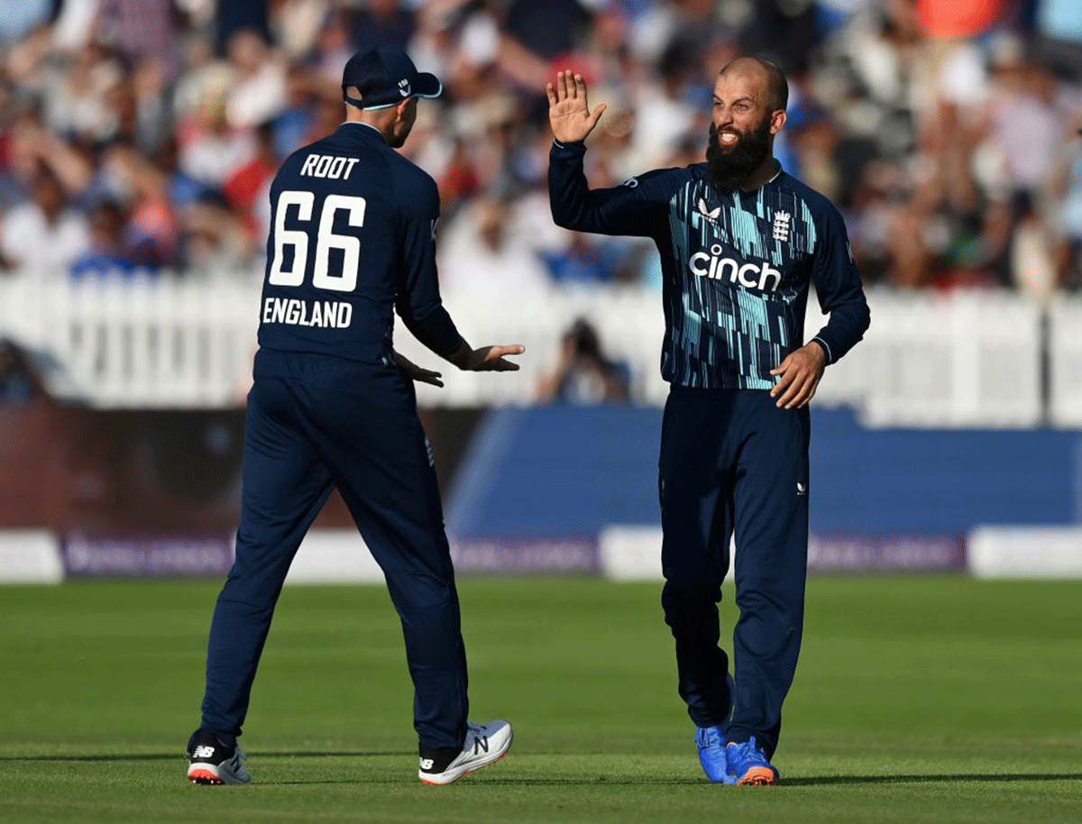 Moeen Ali (right) celebrates with Joe Root after taking the wicket of Hardik Pandya 