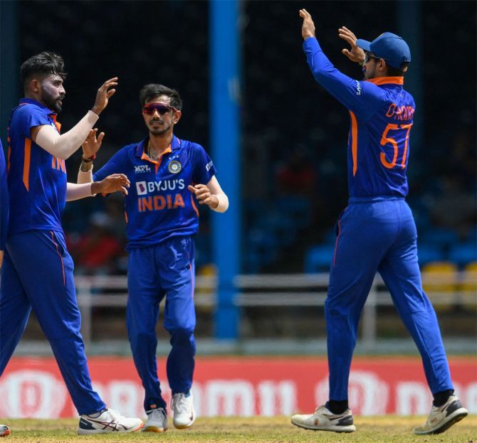 Yuzvendra Chahal joins Mohammed Siraj in celebrating the dismissal of  West Indies captain Nicholas Pooran during the first ODI in Trinidad on Friday.