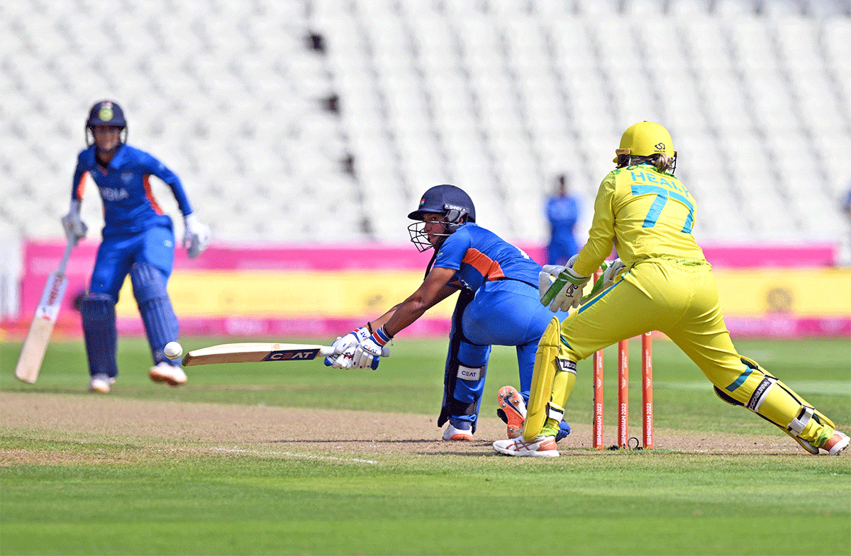 Harmanpreet Kaur plays a sweep shot en route her half-century