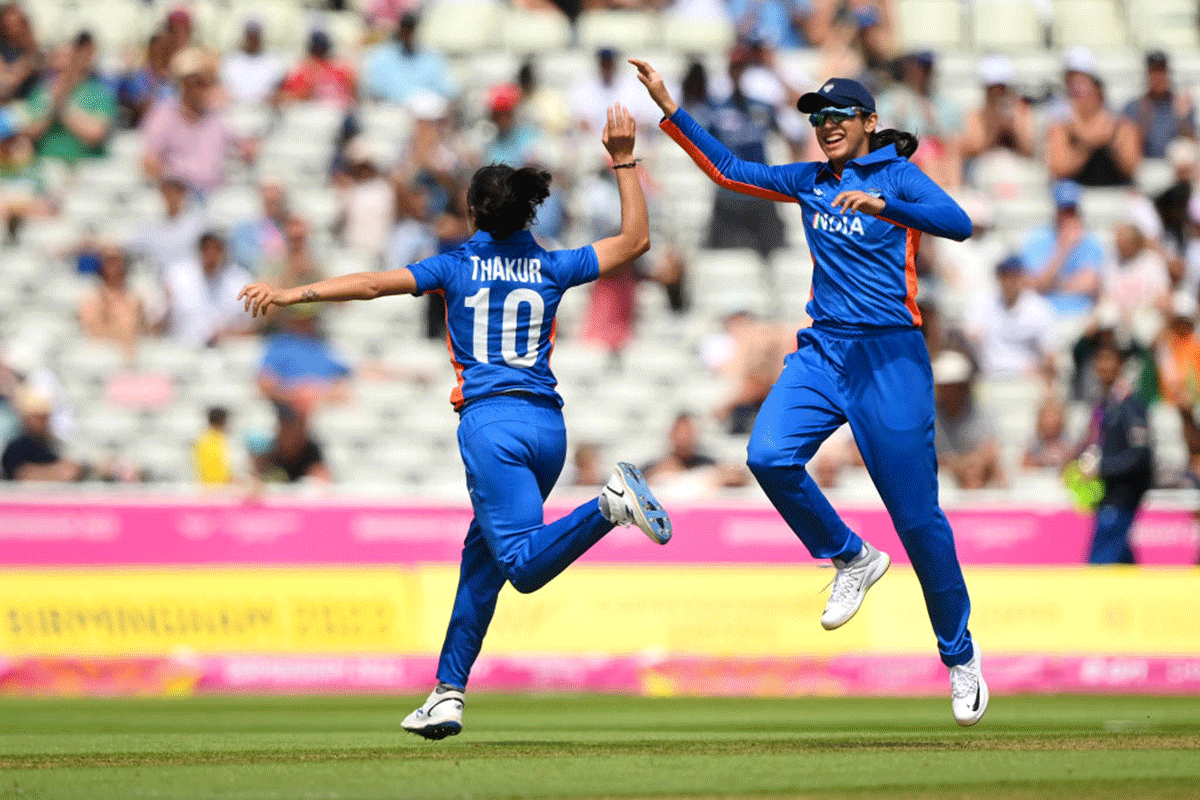 India's Renuka Singh Thakur celebrates the wicket of Australia's Beth Mooney  