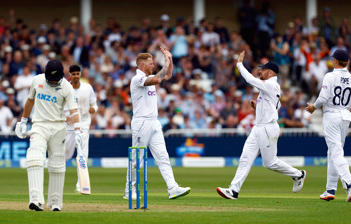 England's Ben Stokes celebrates with Jack Leach after taking the wicket of New Zealand's Will Young