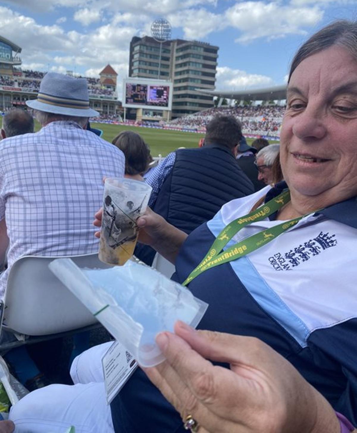 The lady, in whose pint the ball eventually landed inside, shows the remains of her glass after the incident.