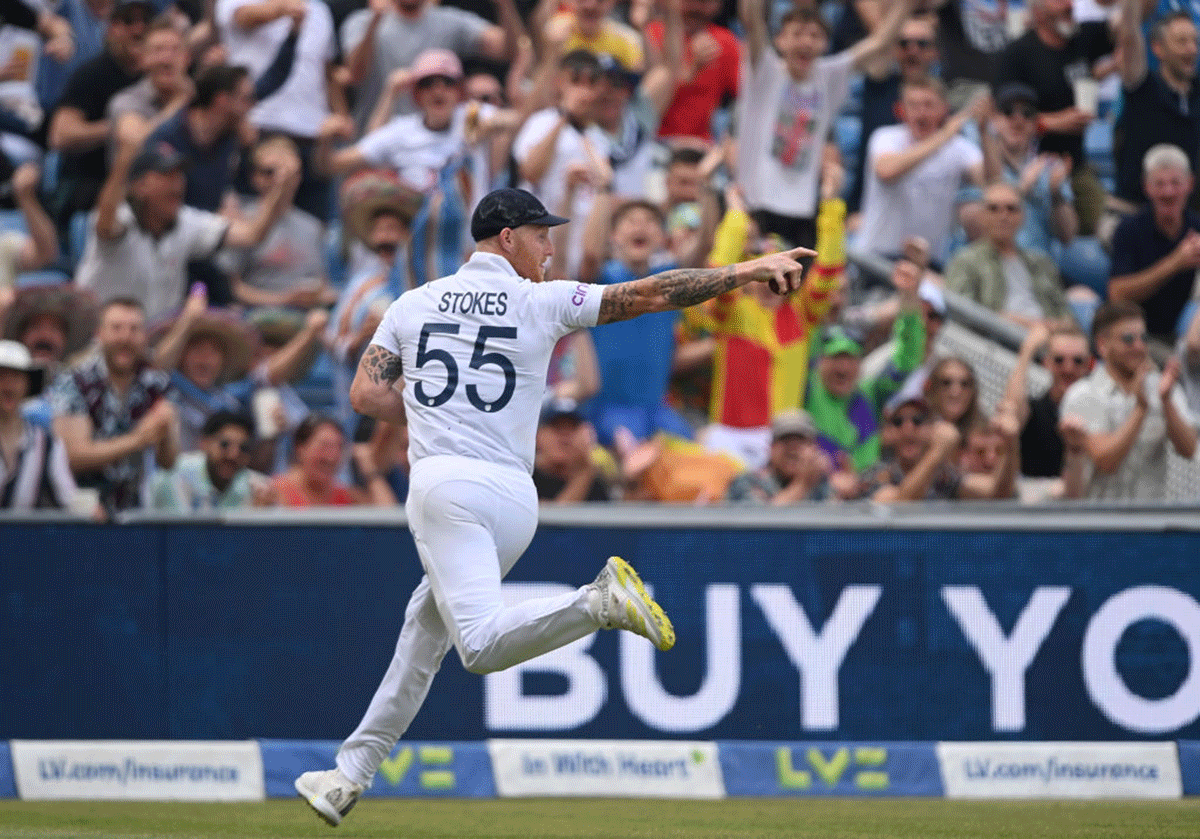 England captain Ben Stokes celebrates after taking a catch to dismiss Daryl Mitchell. 