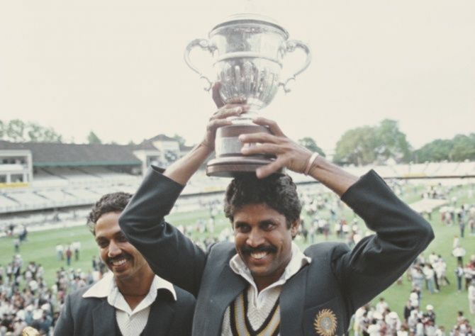 India's captain Kapil Dev hoists the Prudential World Cup, as Man of the Match Mohinder Armanath looks on, June 25, 1983, at Lord's. 