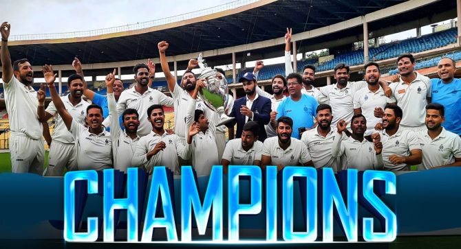 Madhya Pradesh's players celebrate with the Ranji Tropy after defeating Mumbai inthe final at the Chinnaswamy Stadium, in Bengaluru, on Sunday.