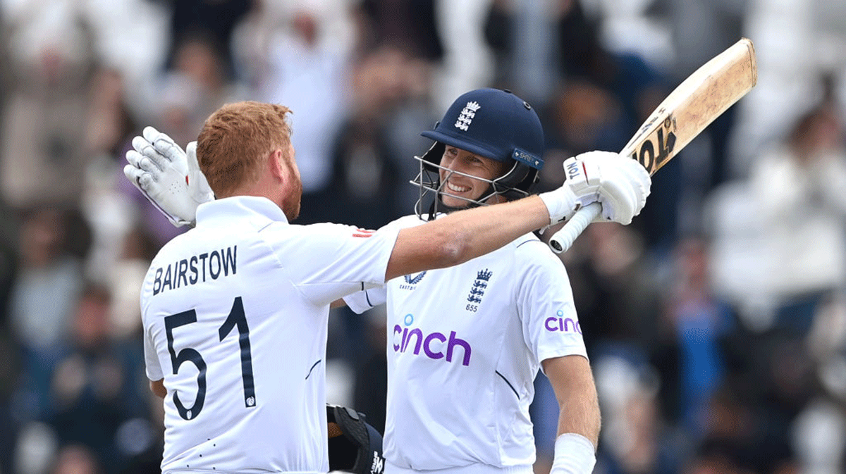  England batsmen Jonny Bairstow (left) and Joe Root celebrate victory