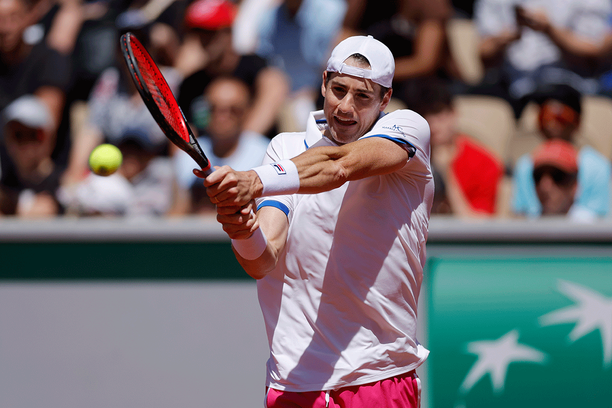 Italy's Jannik Sinner in action during his first round match against Switzerland's Stan Wawrinka