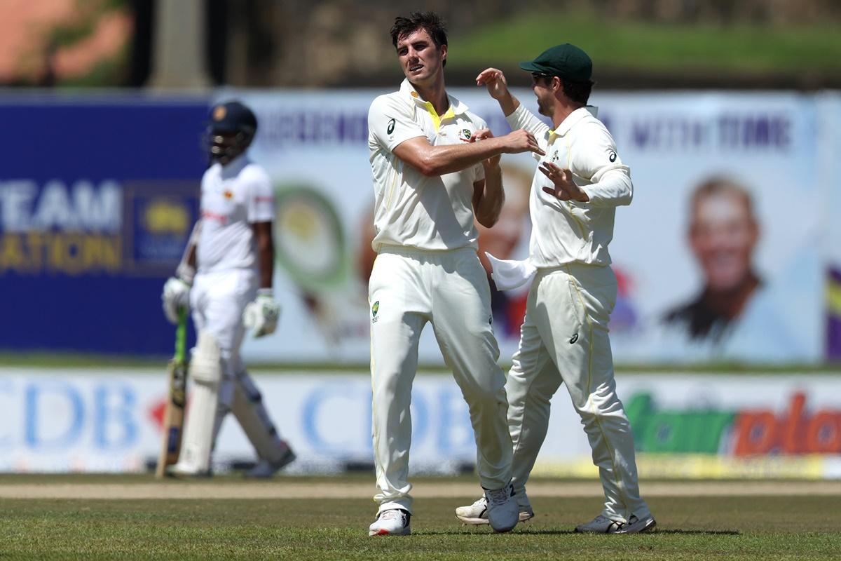 Pat Cummins celebrates after dismissing Pathum Nissanka.