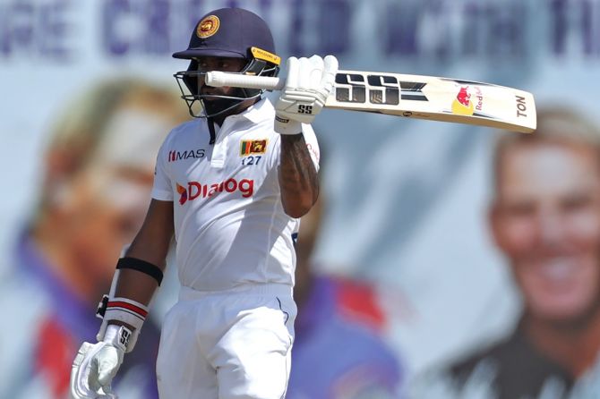 Sri Lanka's stumper-batter Niroshan Dickwella celebrates scoring 50 during Day 1 of the first Test against Australia, at Galle International Stadium, Sri Lanka, on Wednesday.