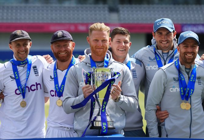 England captain Ben Stokes celebrates with the trophy and teammates after beating New Zealand in the third Test and winning the series 3-0, at Yorkshire Cricket Ground, Leeds, Britain, on June 27, 2022.