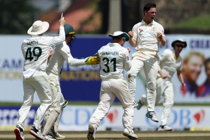 Australia's Mitchell Swepson celebrates with teammates after dismissing Sri Lanka's Dinesh Chandimal