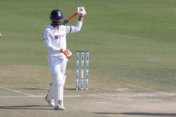 Ravindra Jadeja breaks into his customary sword celebration after completing a half-century.