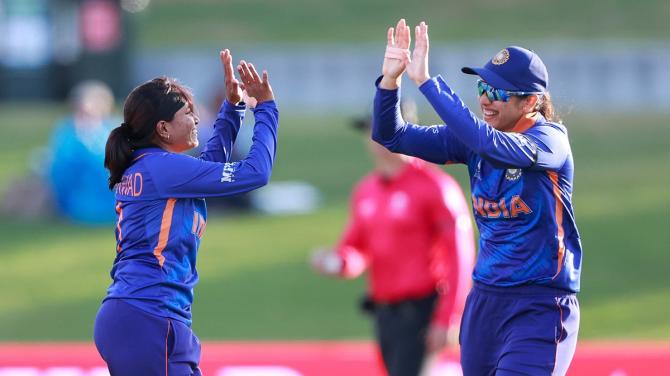 Rajeshwari Gayakwad, left, and Smriti Mandhana celebrate after combining to dismiss Pakistan's Javeria Khan.