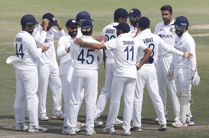 Ravichandran Ashwin celebrates with teammates after taking the wicket of Pathum Nissanka in Sri Lanka's second innings on Sunday