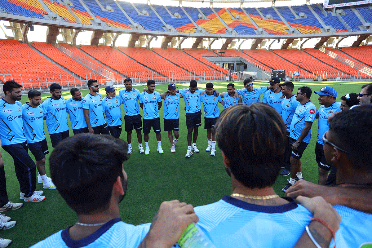 Gujarat Titans coach Ashish Nehra speaks to his players ahead of a training session on Thursday 
